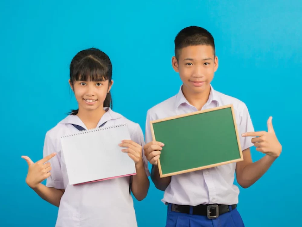 asian-student-holding-notebook-andasian-male-student-holding-green-board-blue_1150-19017